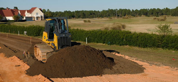 John Deere 850k Dozer leveling land