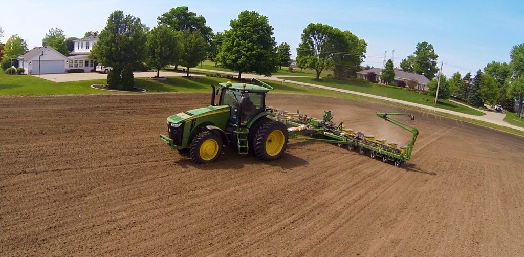 John Deere planter in residential field